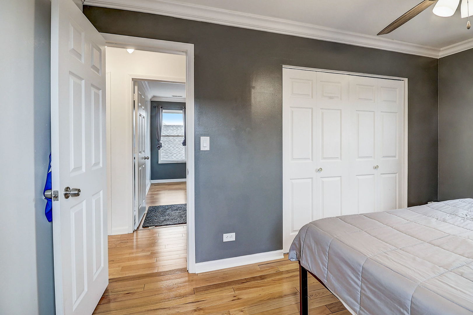 4045 Ruby Street Schiller Park, IL 60176 - Photo 21 of 33 a bedroom with a bed and wooden floor