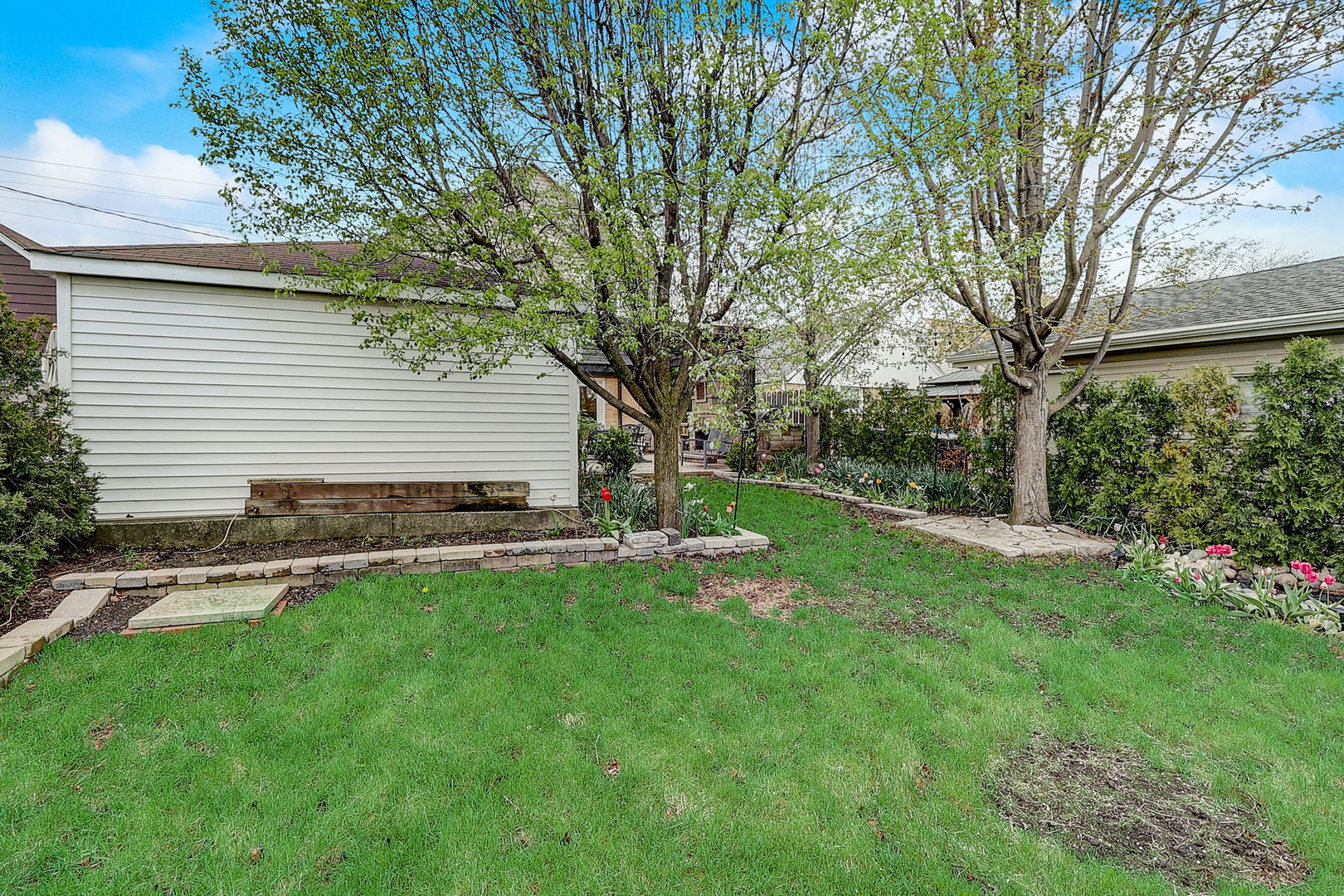 4045 Ruby Street Schiller Park, IL 60176 - Photo 32 of 33 a view of a backyard with a large tree