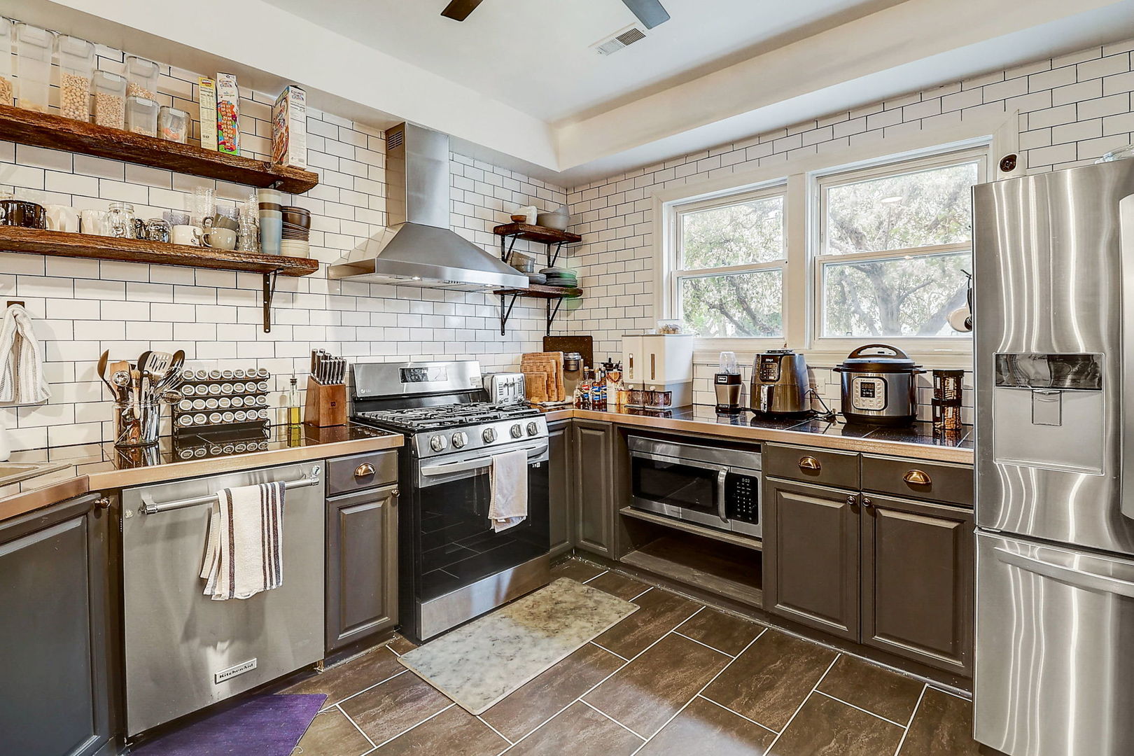 4045 Ruby Street Schiller Park, IL 60176 - Photo 7 of 33 a kitchen with stainless steel appliances granite countertop a stove and a sink