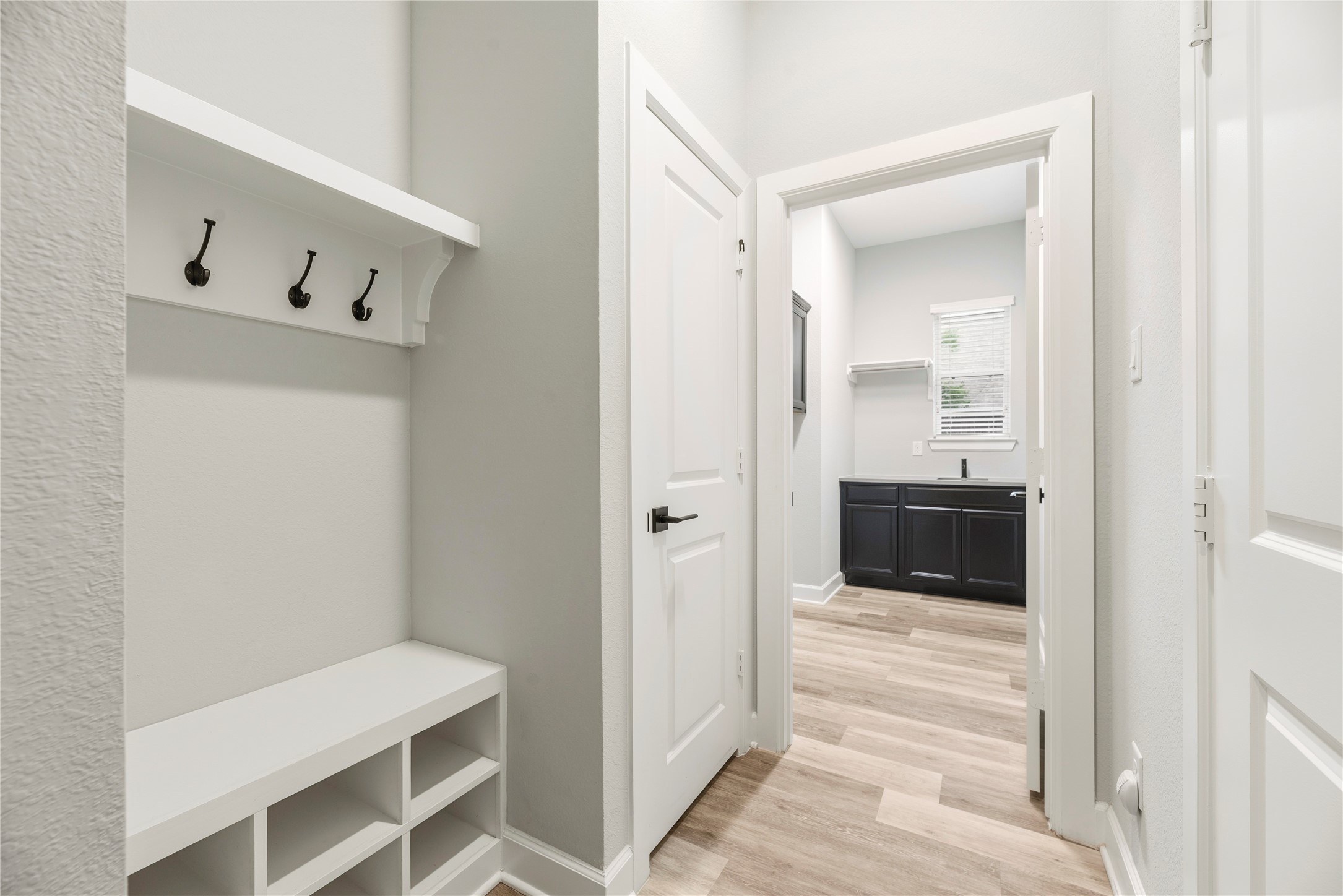 3438 Rich Radish Road Richmond, TX 77406 - Photo 16 of 25 This practical mudroom drop-zone has been beautifully upgraded with a built-in backpack rack, coat hooks, and a custom shoe divider.