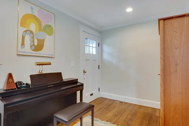 a large kitchen with kitchen island a lot of counter space and wooden floor