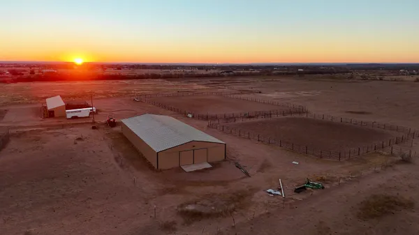 an aerial view of a house with ocean view