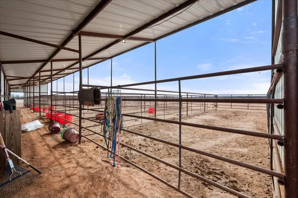 a kitchen with a table chairs stove and wooden floor