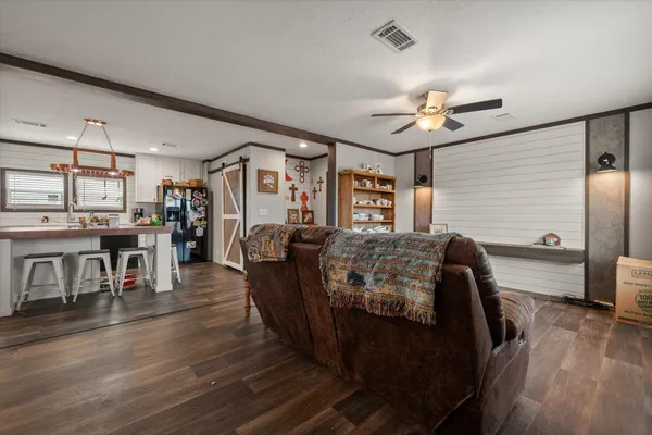 a view of an empty room with closet area
