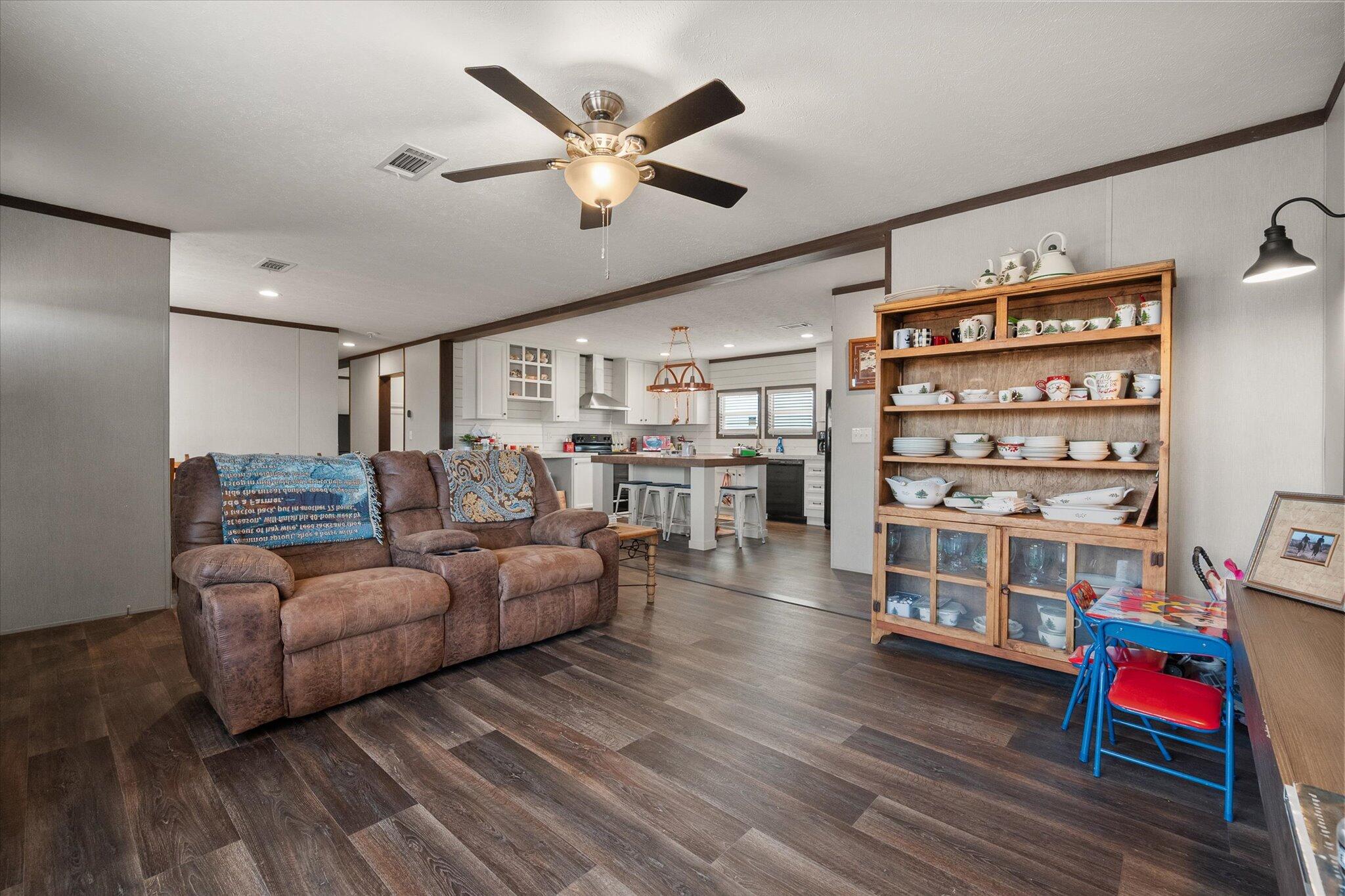 3013 West 15th Street Post, TX 79356 - Photo 44 of 71 a living room with furniture and hard wood flooring