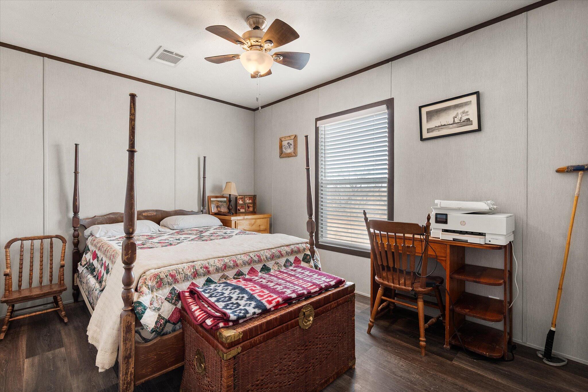 3013 West 15th Street Post, TX 79356 - Photo 64 of 71 a bed room with a bed window and a chair