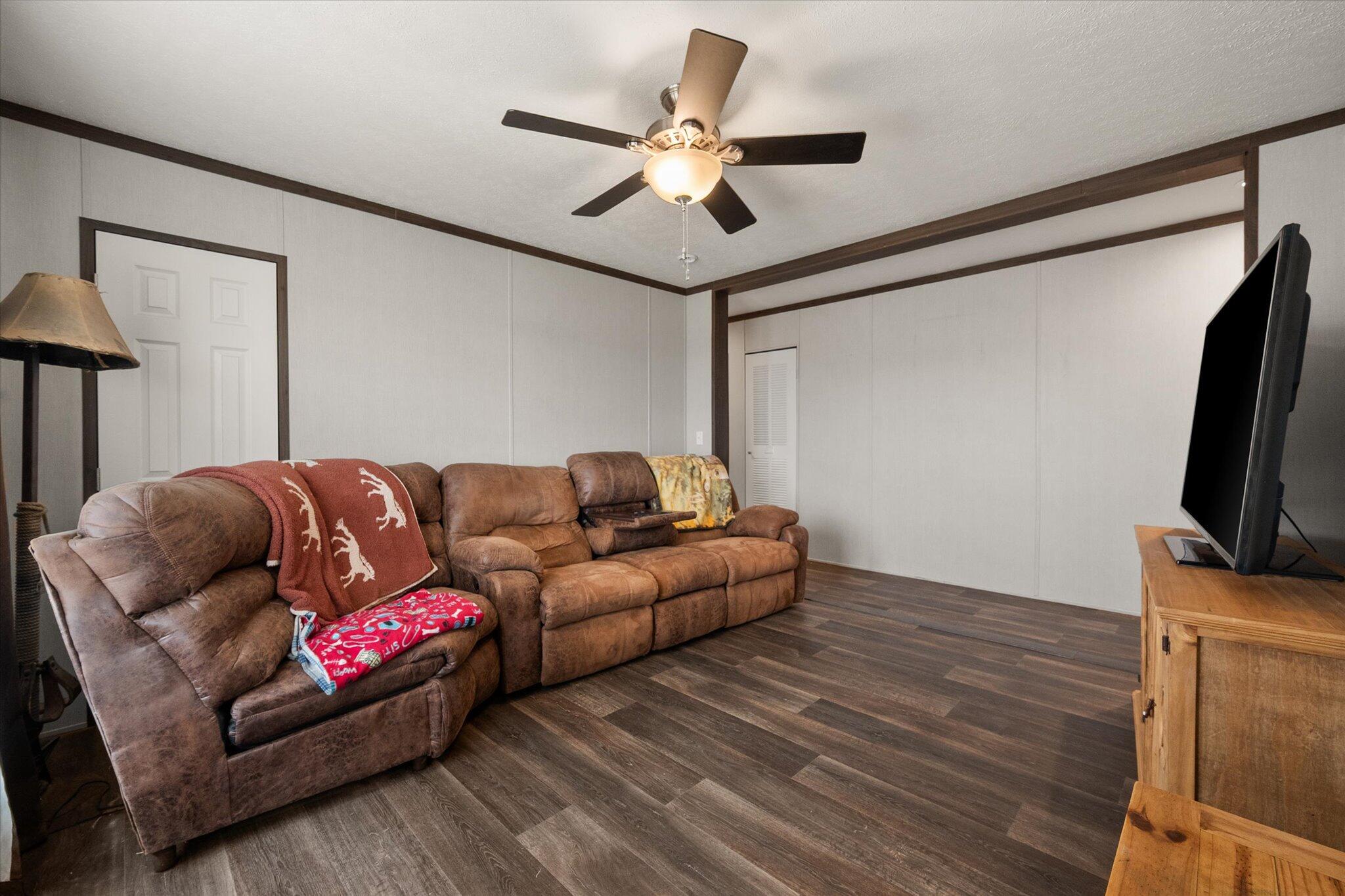3013 West 15th Street Post, TX 79356 - Photo 65 of 71 a living room with furniture and a flat screen tv