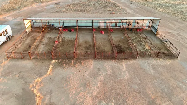 an aerial view of residential building with ocean view