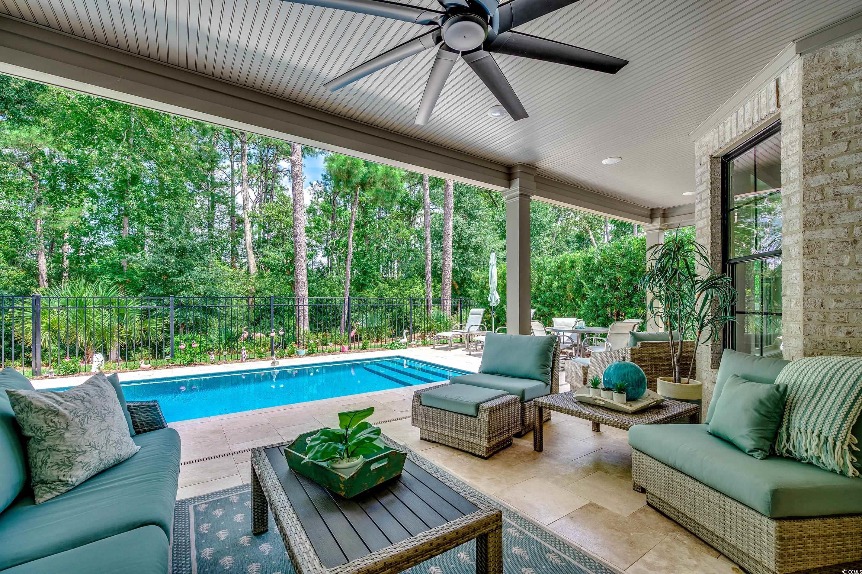 8404 Cape Dutch Loop Myrtle Beach, SC 29572 - Photo 29 of 40 View of pool with outdoor lounge area, a patio area, a fenced backyard, and a ceiling fan