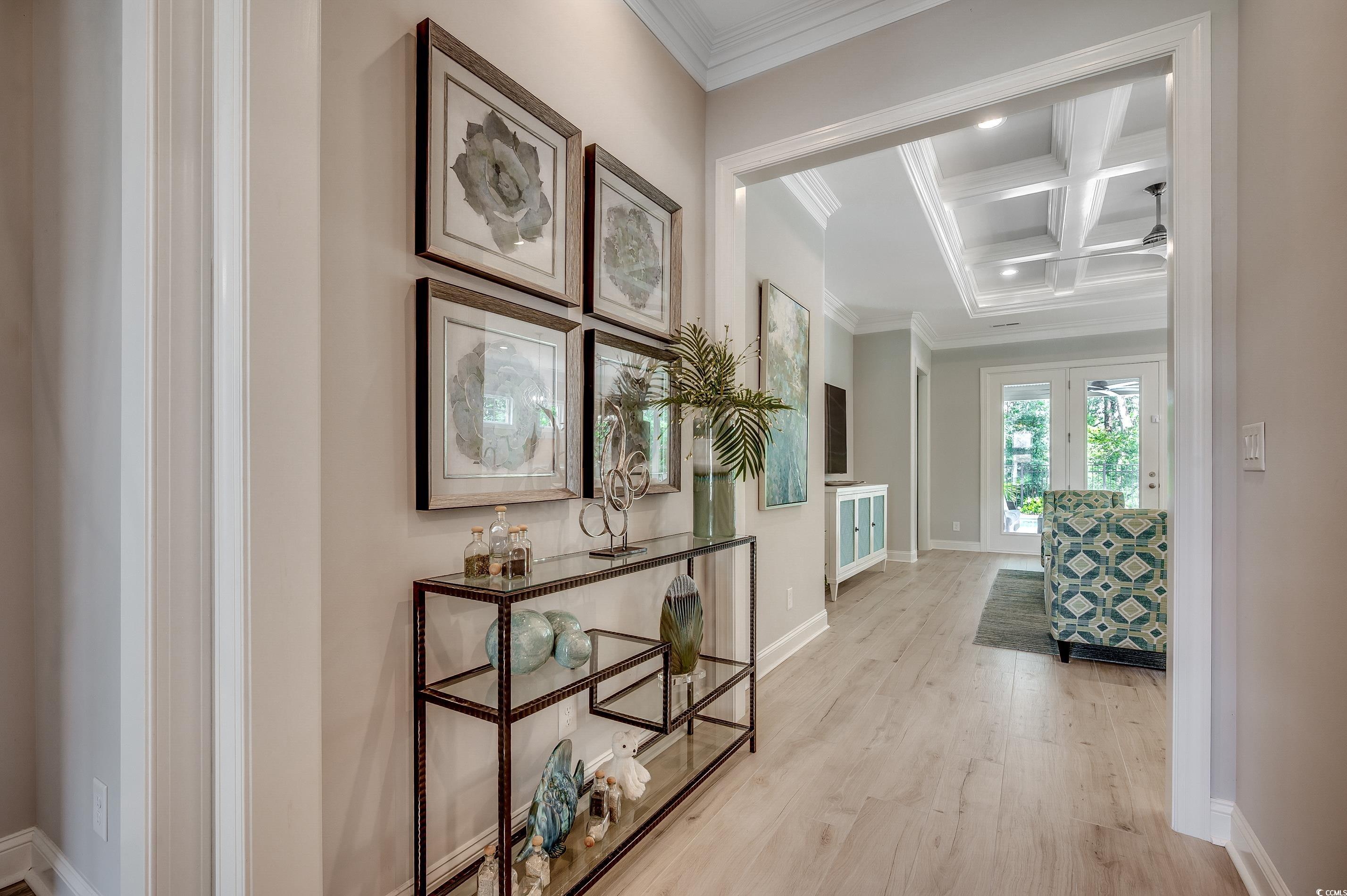 8404 Cape Dutch Loop Myrtle Beach, SC 29572 - Photo 5 of 40 Hallway featuring coffered ceiling, beam ceiling, light wood-style flooring, crown molding, and recessed lighting