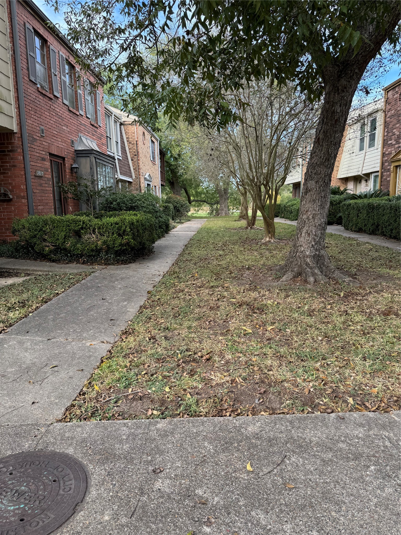 7815 Grove Ridge Drive Houston, TX 77061 - Photo 2 of 28 a front view of a house with a yard