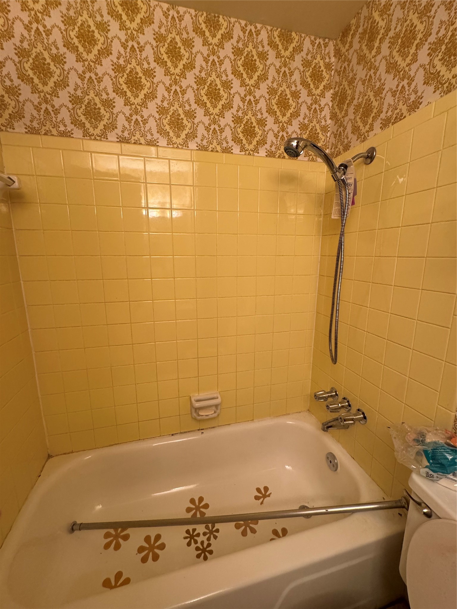 7815 Grove Ridge Drive Houston, TX 77061 - Photo 5 of 28 a bathroom with a bathtub and shower