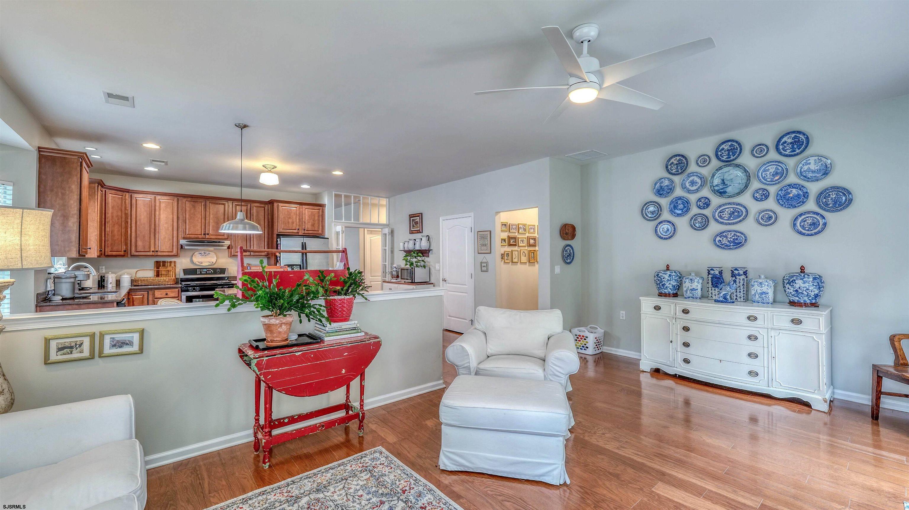 243 Lily Road Egg Harbor Township, NJ 08234 - Photo 12 of 29 a living room with furniture and a wooden floor