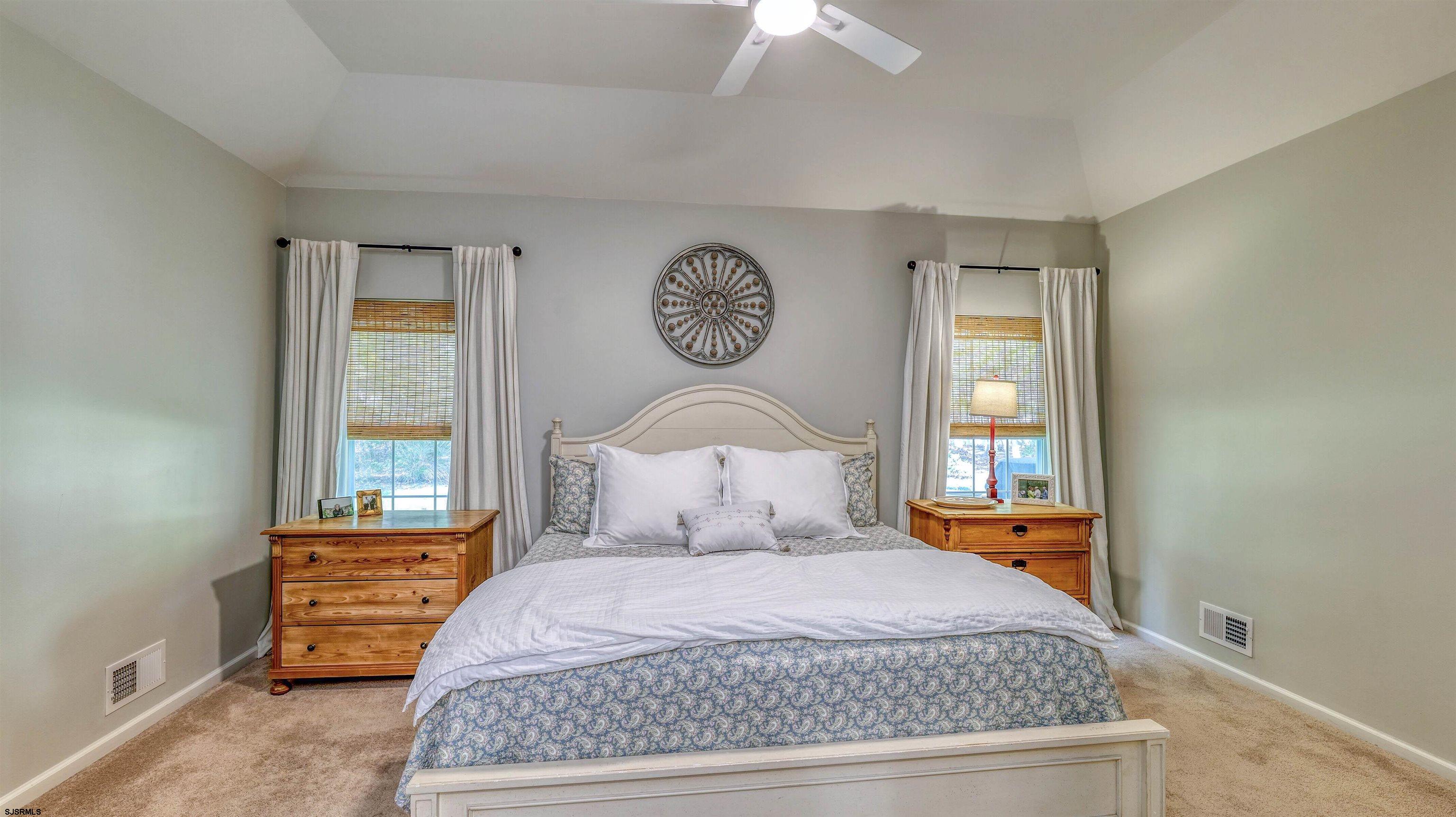 243 Lily Road Egg Harbor Township, NJ 08234 - Photo 14 of 29 a bedroom with a bed and window