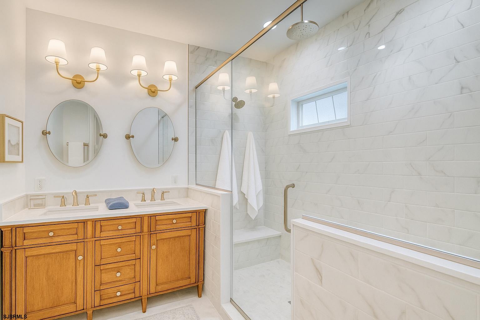 243 Lily Road Egg Harbor Township, NJ 08234 - Photo 16 of 29 a bathroom with a double vanity sink mirror and shower