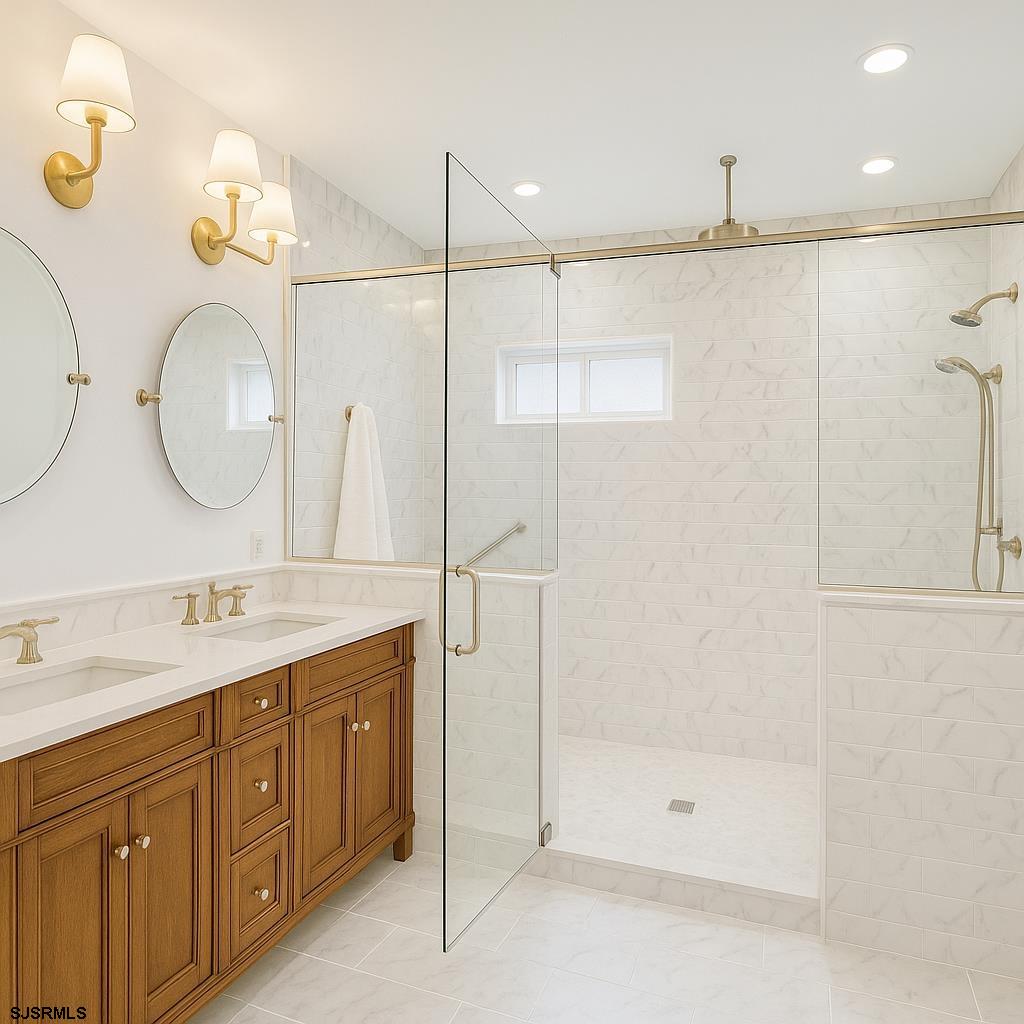 243 Lily Road Egg Harbor Township, NJ 08234 - Photo 17 of 29 a bathroom with a double vanity sink mirror and shower