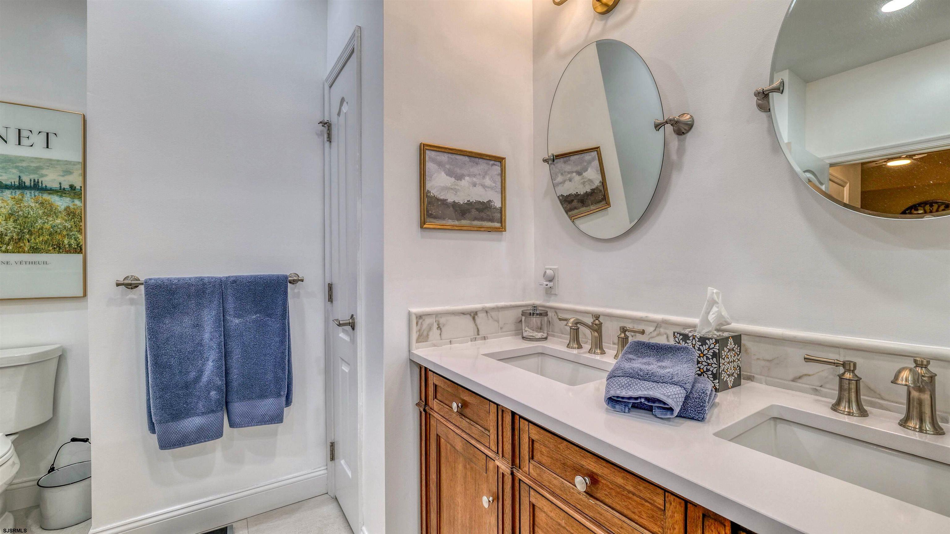 243 Lily Road Egg Harbor Township, NJ 08234 - Photo 18 of 29 a bathroom with a sink and a mirror