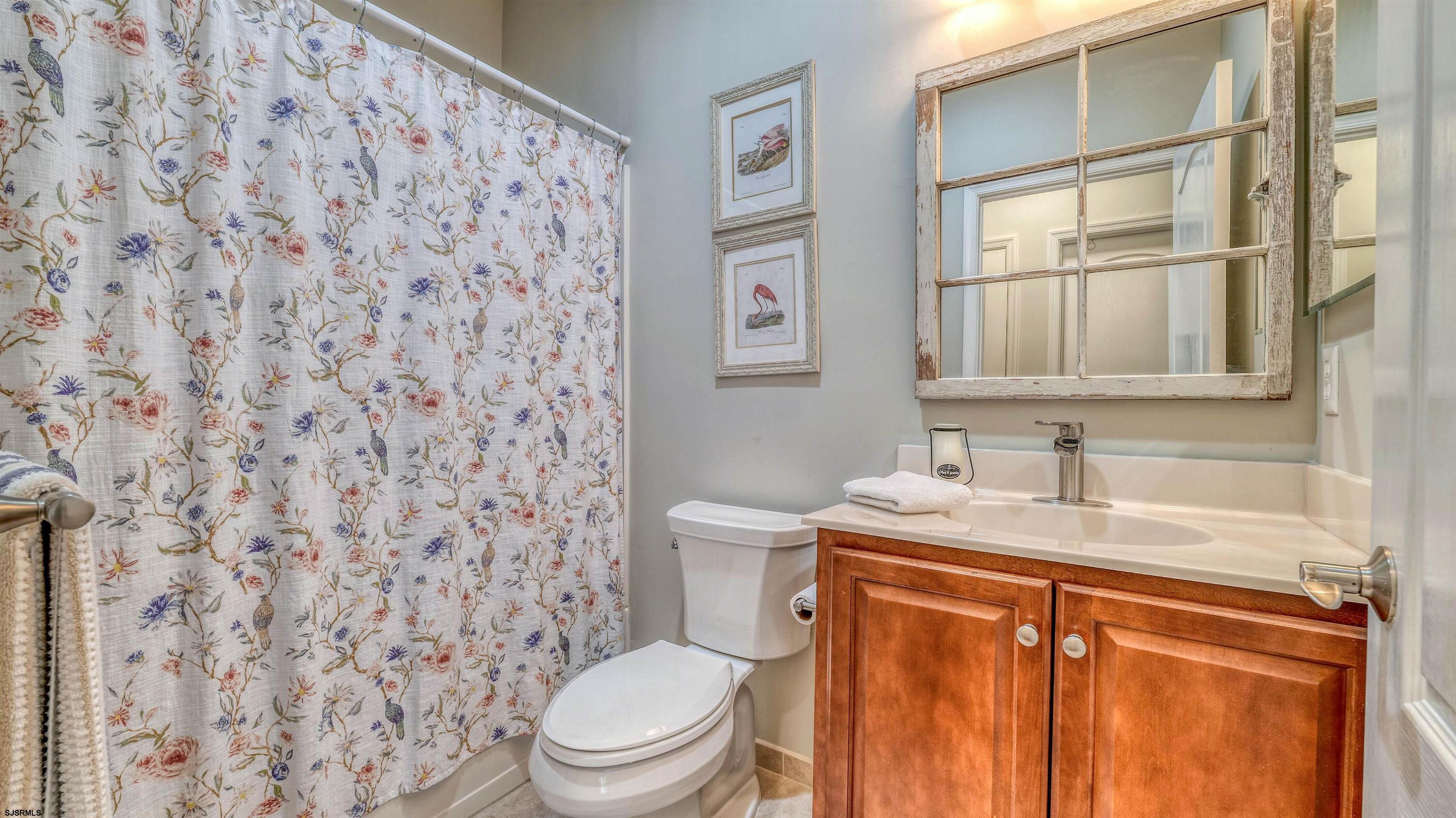 243 Lily Road Egg Harbor Township, NJ 08234 - Photo 19 of 29 a bathroom with a granite countertop toilet sink and mirror