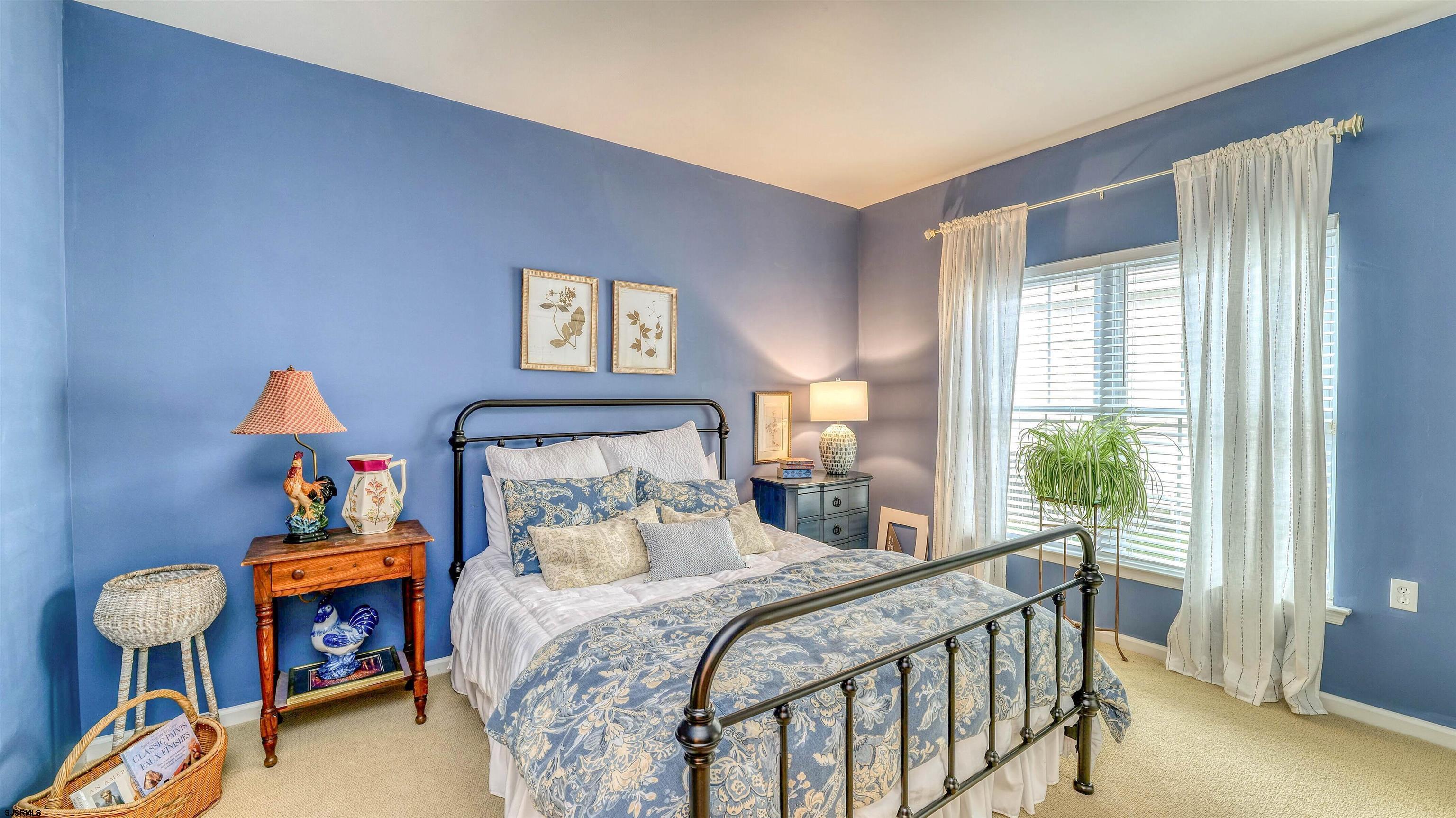 243 Lily Road Egg Harbor Township, NJ 08234 - Photo 21 of 29 a bedroom with a bed and a window