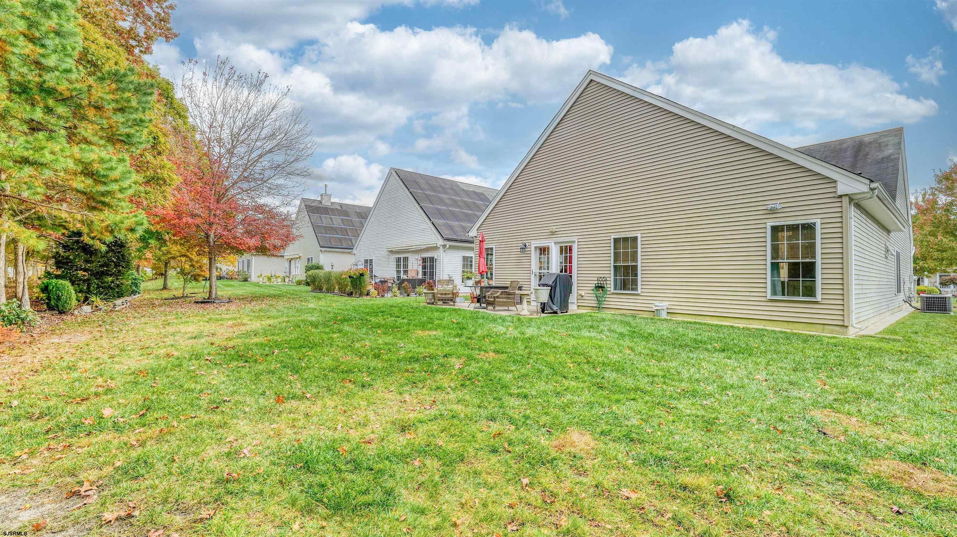 243 Lily Road Egg Harbor Township, NJ 08234 - Photo 27 of 29 a view of a house with backyard and garden