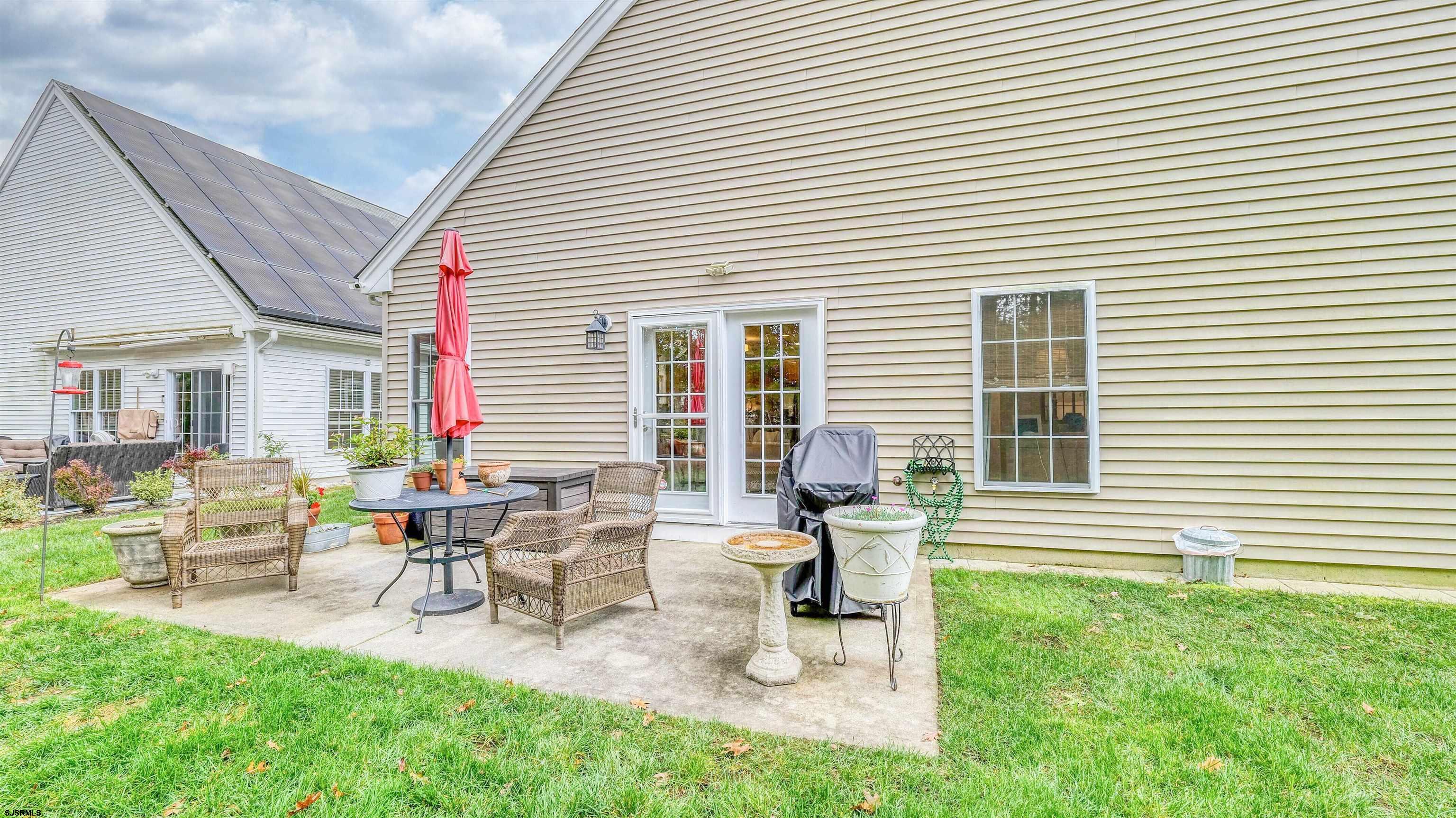 243 Lily Road Egg Harbor Township, NJ 08234 - Photo 28 of 29 a view of a house with backyard and sitting area