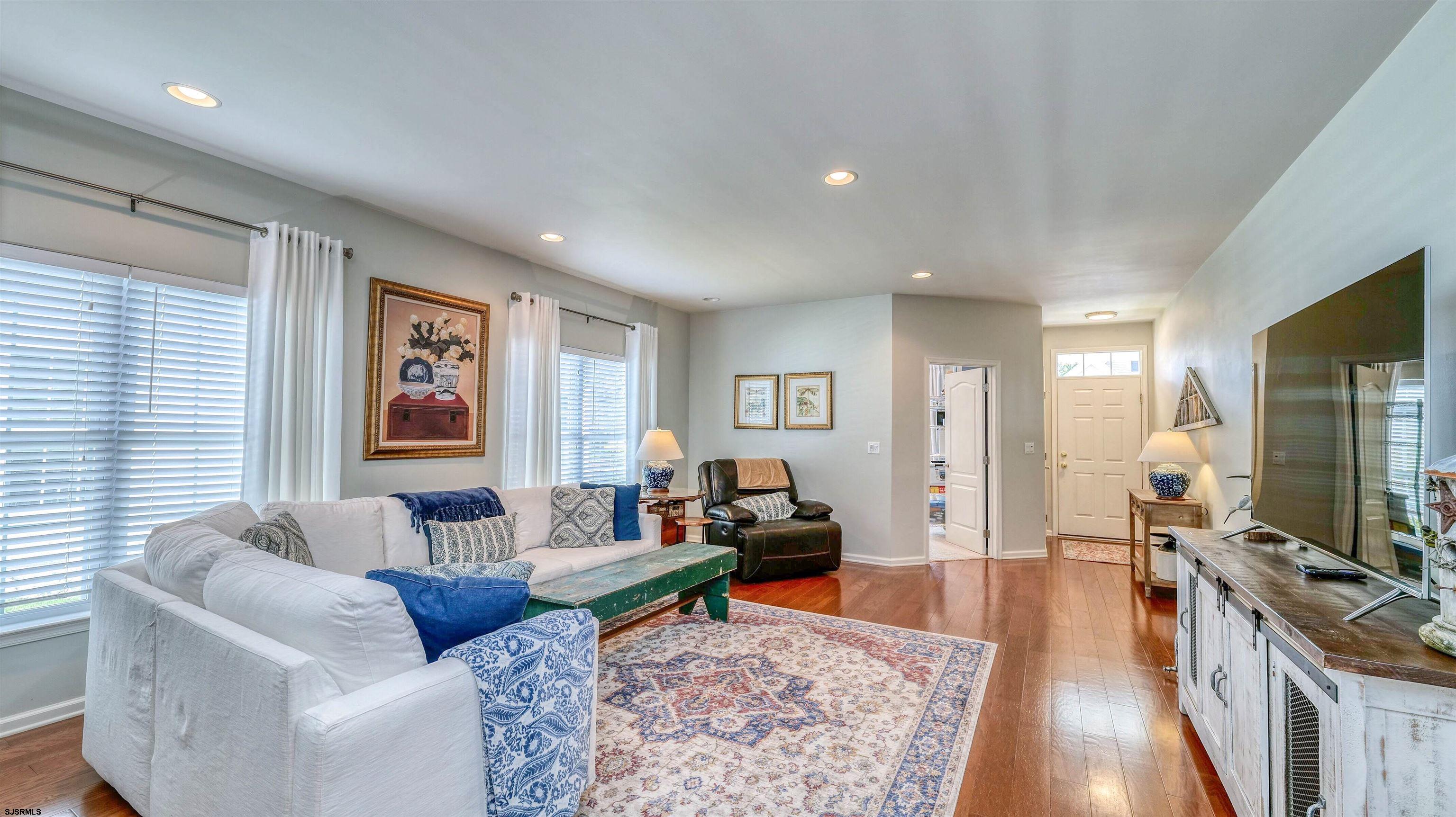 243 Lily Road Egg Harbor Township, NJ 08234 - Photo 6 of 29 a living room with furniture and a flat screen tv