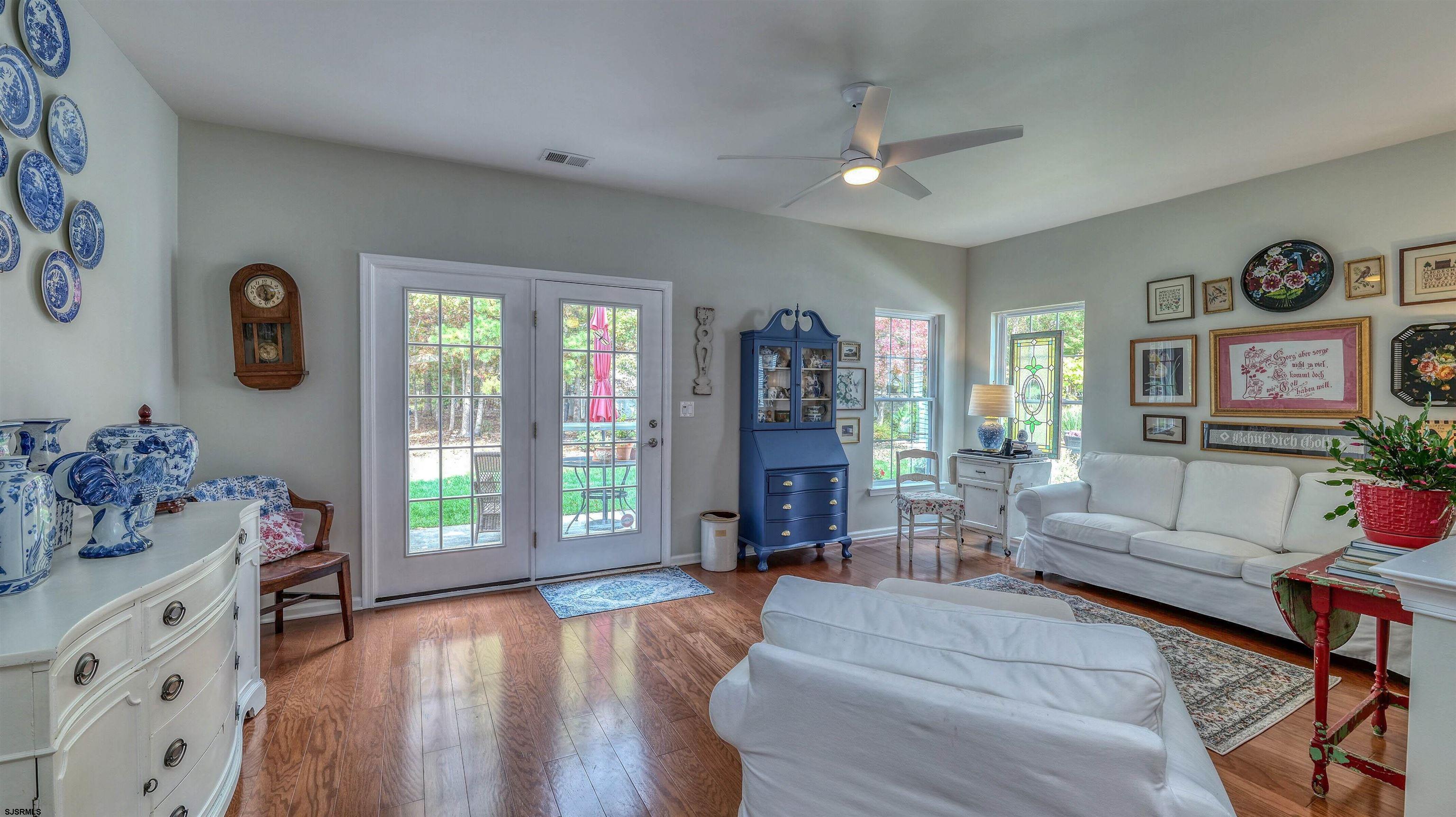 243 Lily Road Egg Harbor Township, NJ 08234 - Photo 10 of 29 a living room with furniture and wooden floor