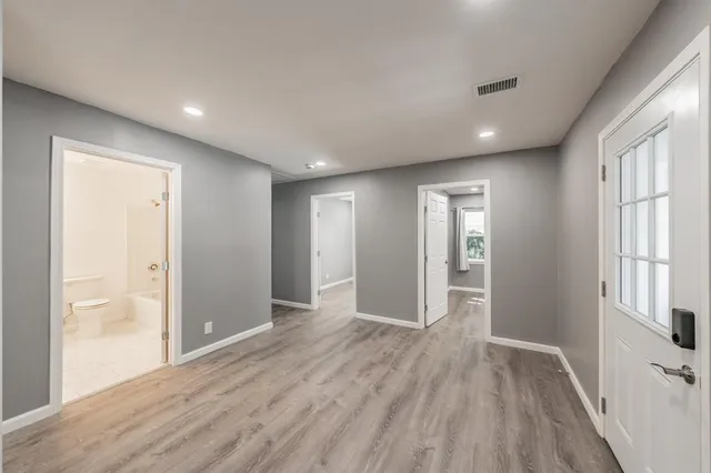 a view of kitchen with wooden floor and windows