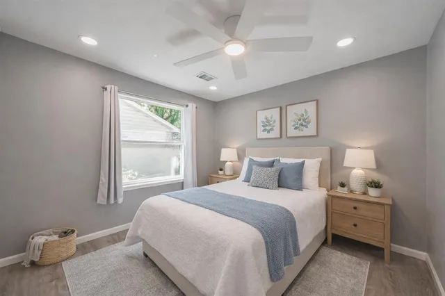 a bedroom with a bed and a window