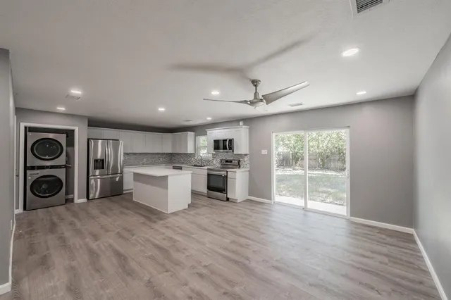 a view of a kitchen with microwave and stove