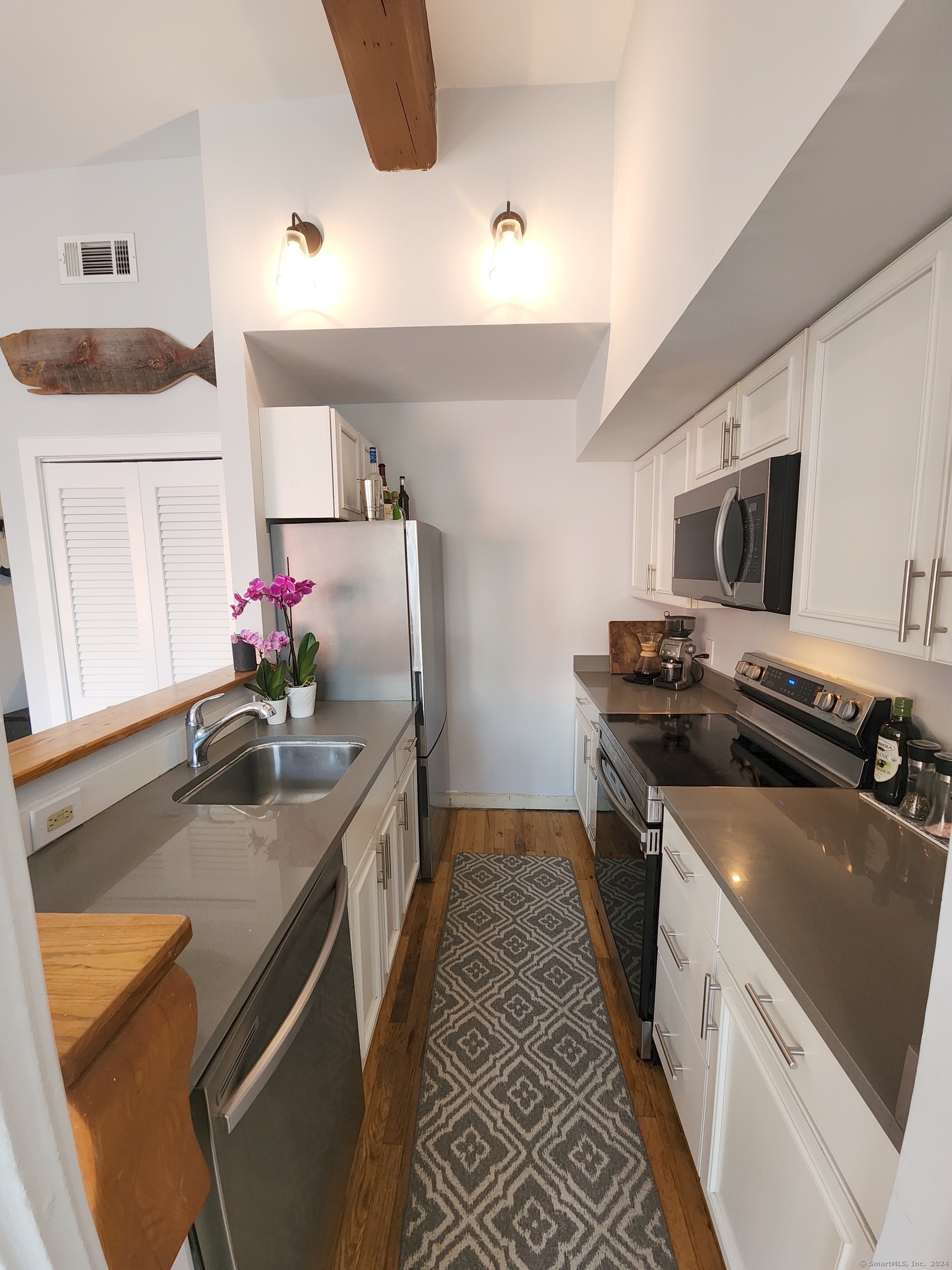 2 South Main Street, Unit W201 Norwalk, CT 06854 - Photo 5 of 10 a kitchen that has a sink and a stove