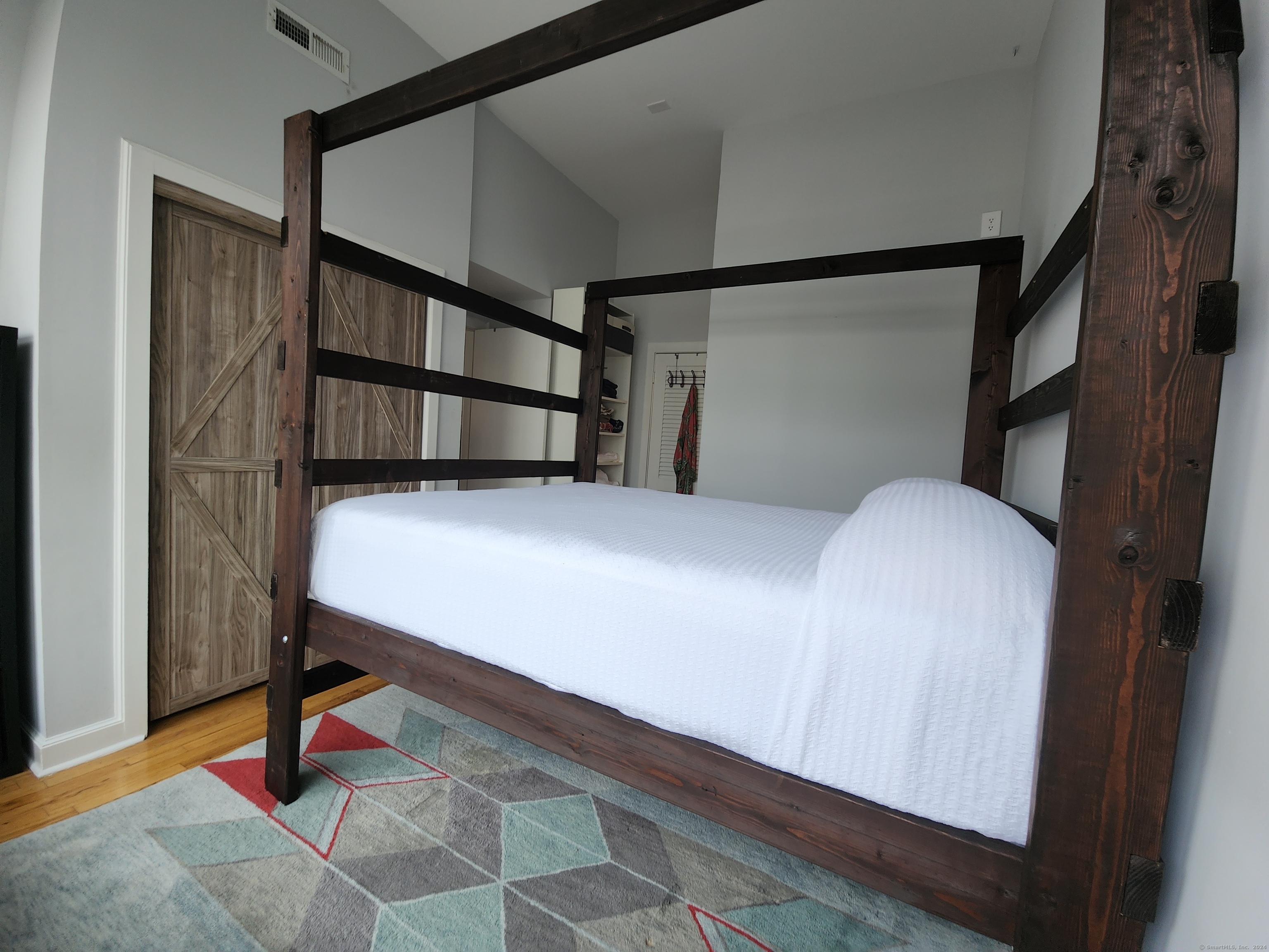 2 South Main Street, Unit W201 Norwalk, CT 06854 - Photo 10 of 10 a bedroom with a bed and a window