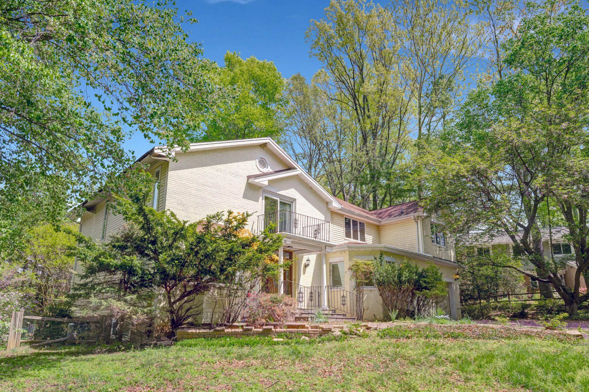 10910 Miller Road Oakton, VA 22124 - Photo 2 of 58 Charming home nestled in lush greenery.