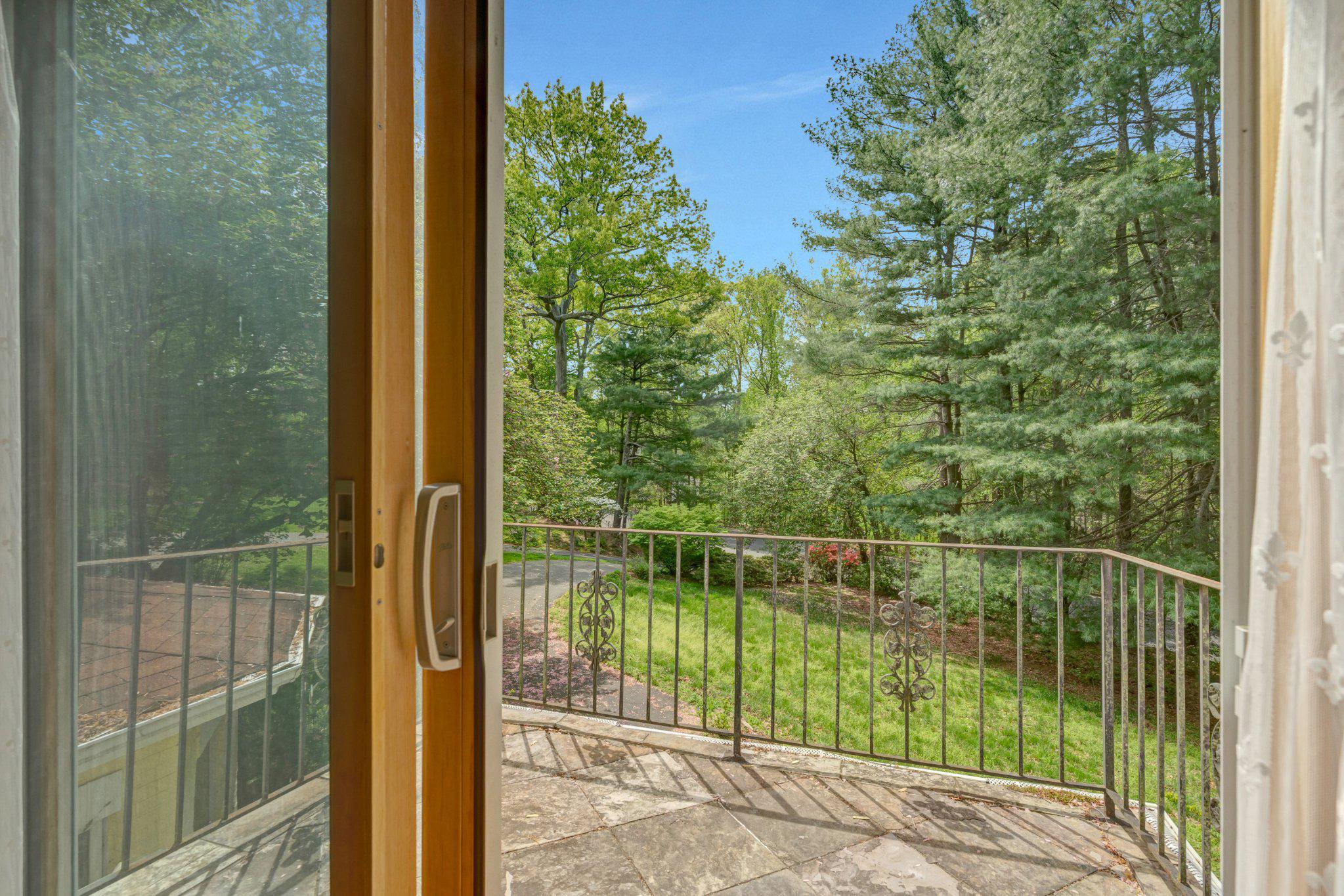 10910 Miller Road Oakton, VA 22124 - Photo 27 of 58 Serene balcony view of lush greenery.