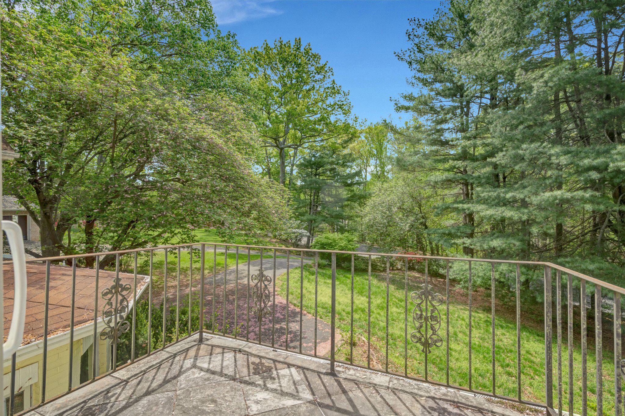 10910 Miller Road Oakton, VA 22124 - Photo 28 of 58 Serene balcony view of lush greenery.