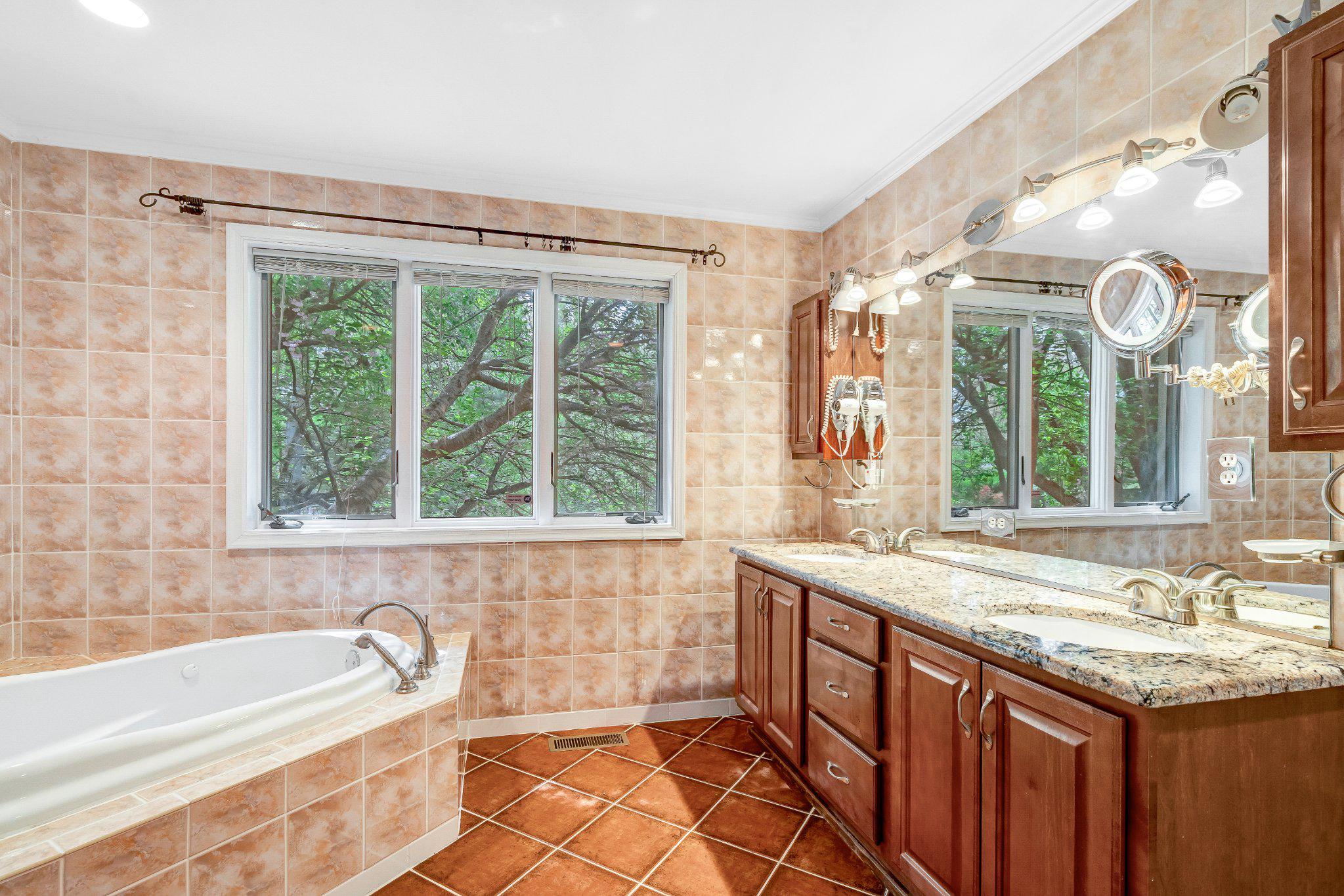 10910 Miller Road Oakton, VA 22124 - Photo 29 of 58 Serene bathroom with natural light.
