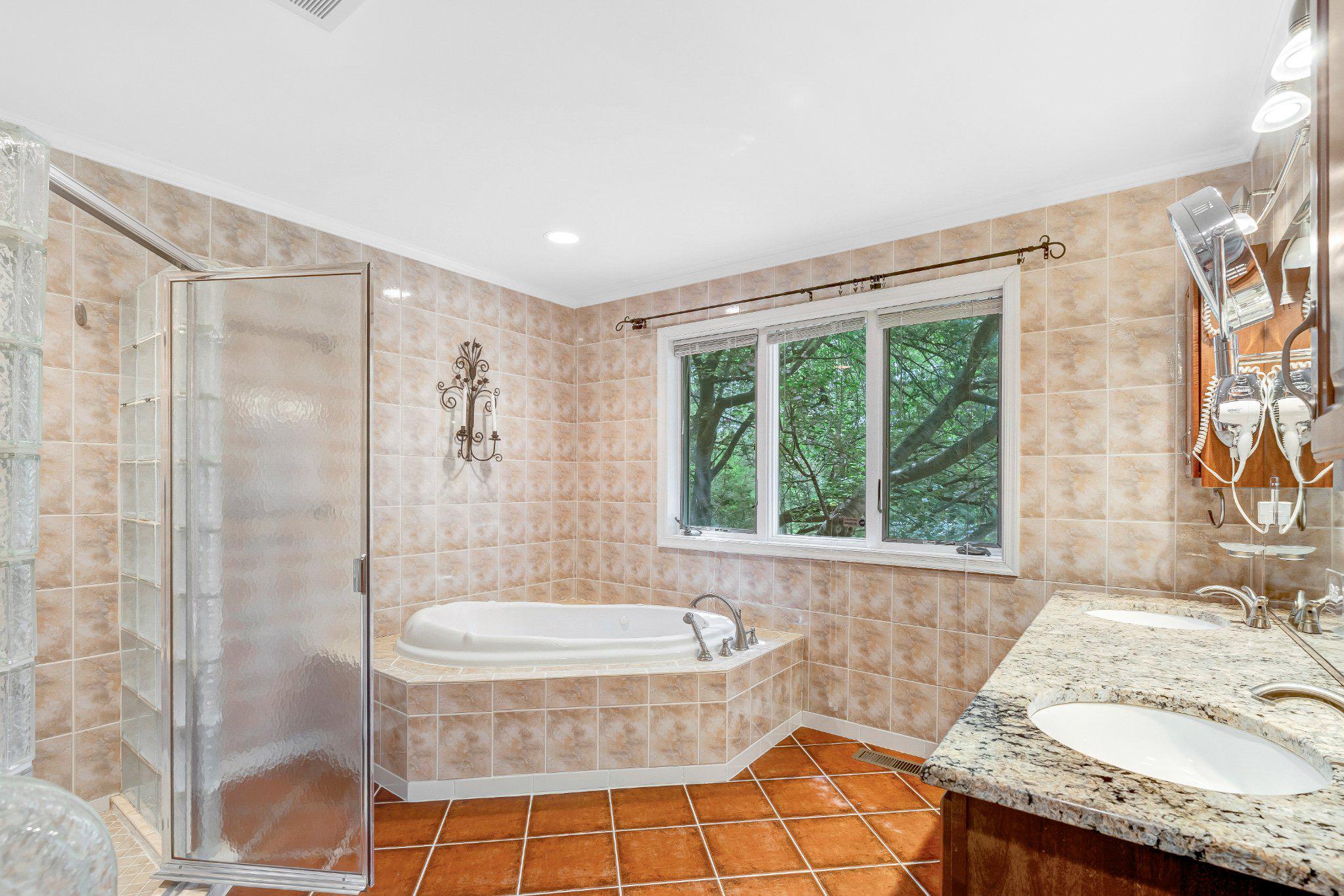10910 Miller Road Oakton, VA 22124 - Photo 30 of 58 Serene bathroom with natural light.