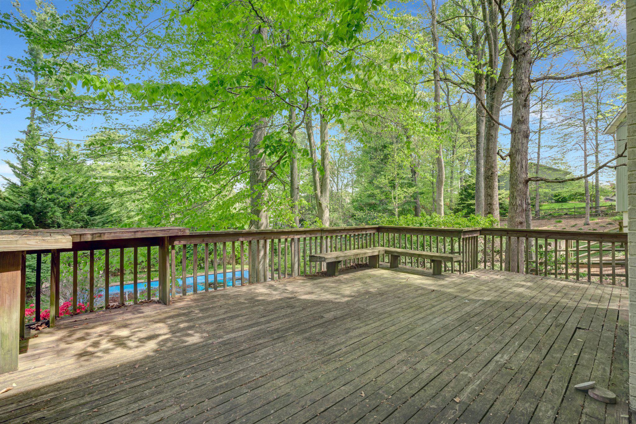 10910 Miller Road Oakton, VA 22124 - Photo 51 of 58 Serene deck surrounded by lush greenery.