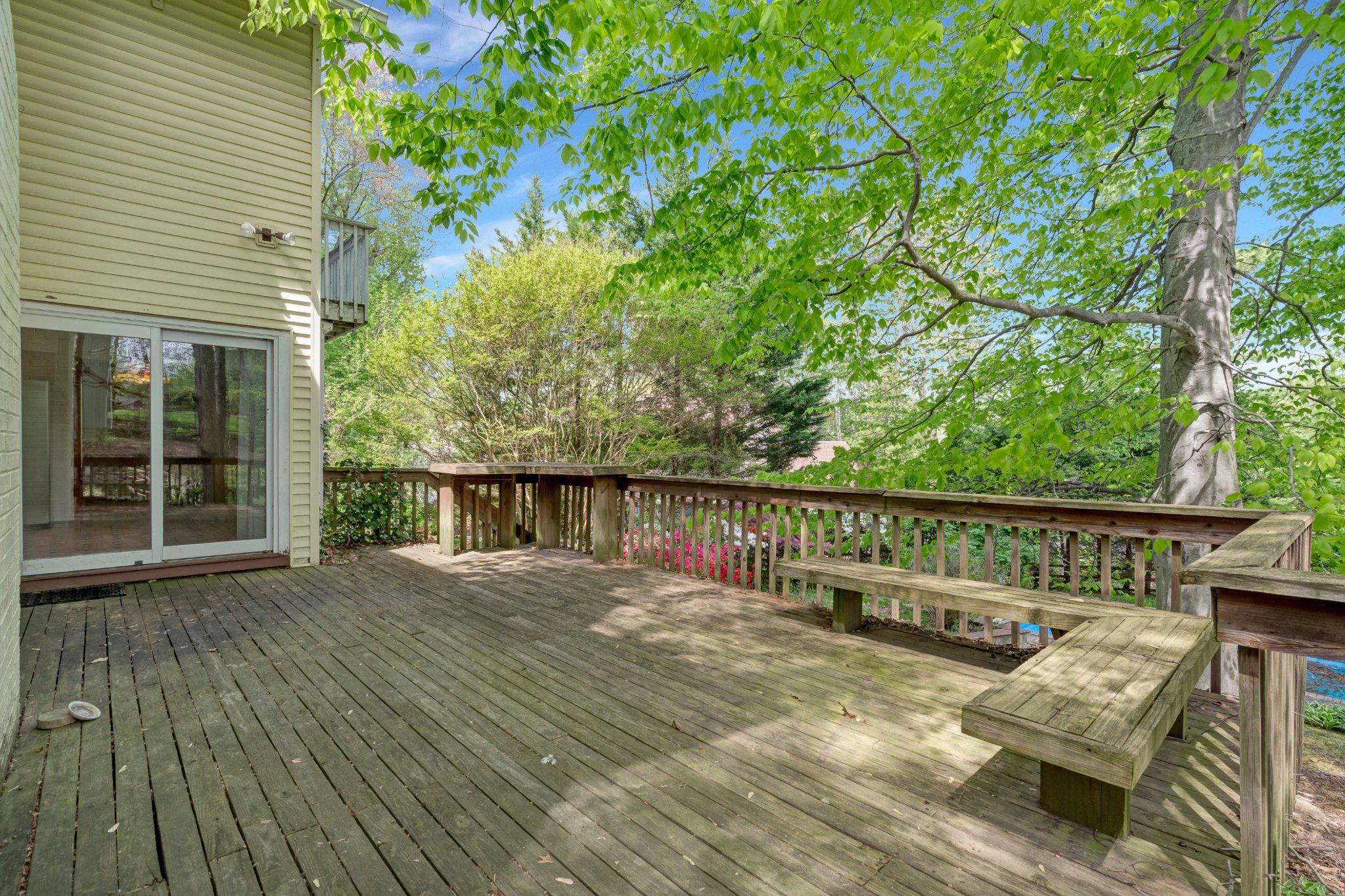 10910 Miller Road Oakton, VA 22124 - Photo 52 of 58 Serene deck surrounded by lush greenery.