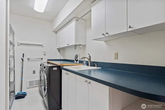 a kitchen with a sink and cabinets