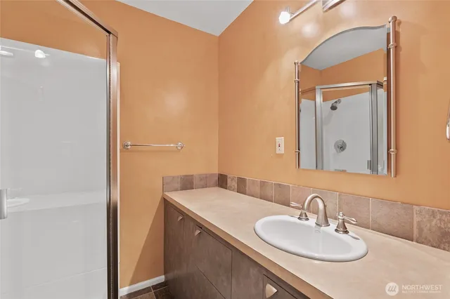 a bathroom with a sink and a mirror