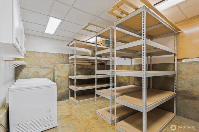 a view of an empty room with empty shelves