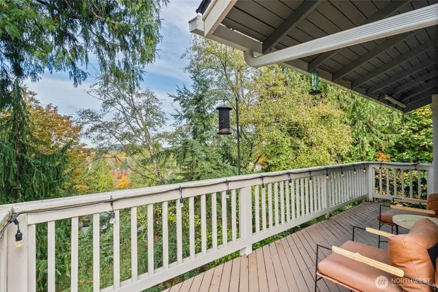 a view of a balcony with wooden floor