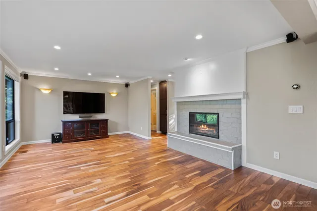 a room with a bed and a flat screen tv