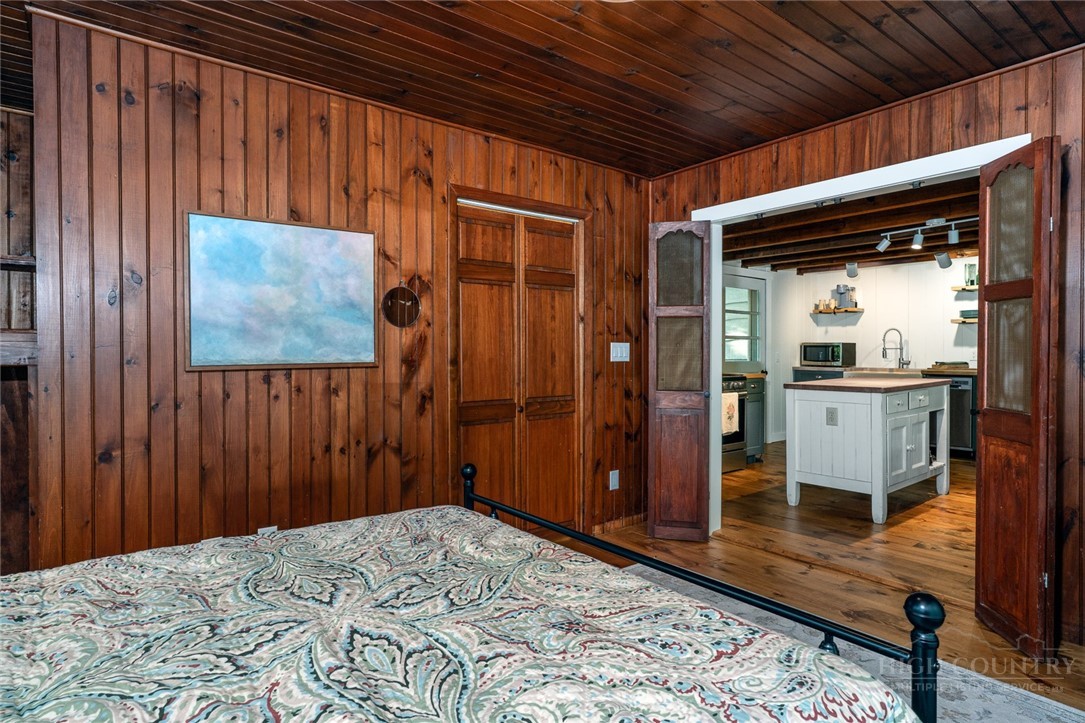 217 Holiday Hills Drive Boone, NC 28607 - Photo 19 of 26 a bedroom with a bed and a dresser