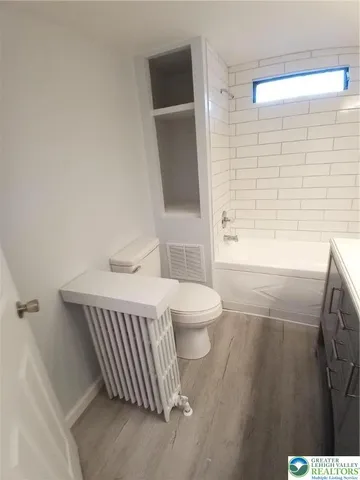 a bathroom with a sink and toilet