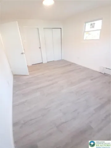 a view of an empty room with entrance