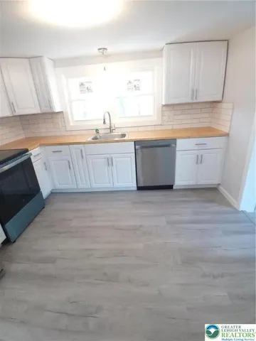 a large kitchen with a large window