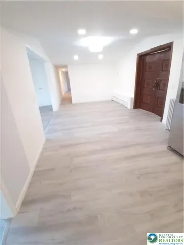 a view of a hallway with stairs