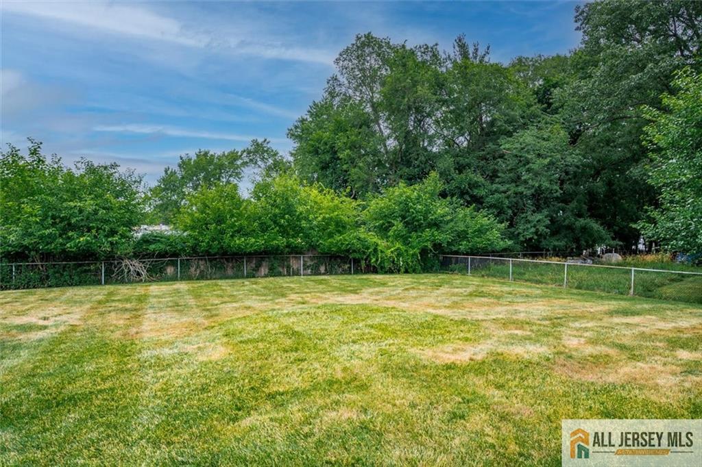 21 Tyndall Road Kendall Park, NJ 08824 - Photo 26 of 33 a view of a pool with a big yard